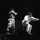 Chuck D and a member of the S1Ws on stage in London, 1987.